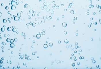 Soda water with bubbles as background, closeup