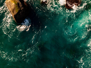 Top view seashore waves nature background,Amazing waves crashing on rocks seascape view