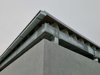 The gutter of the warehouse building is missing. Apparently someone stole it. Water sprays onto the...