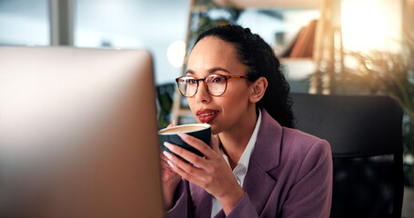 Woman, business and coffee at computer with glasses, morning routine and reading in office....