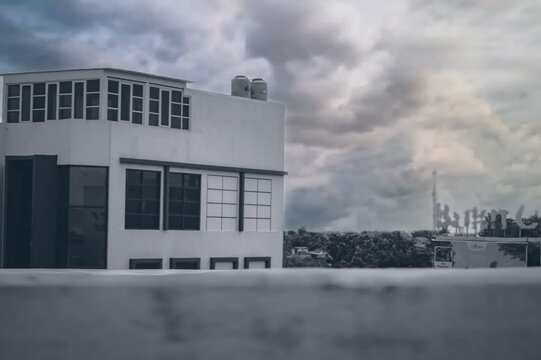 Heavy Clouds Drifting Above Urban Buildings