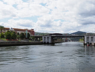 Steel old bridge at Nervion river in European Bilbao city in Spain