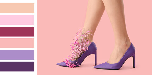 Female legs in high heels with gypsophila flowers on pink background