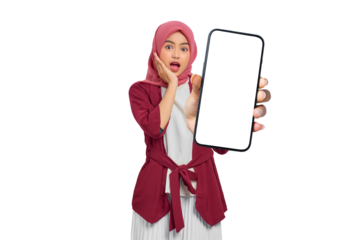 Surprised young Asian Muslim woman with hijab holding smartphone with blank screen isolated on transparent background