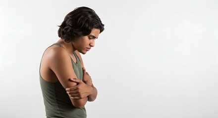 Man with arm pain seeking medical advice and treatment for injury or discomfort on white background