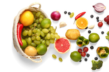 Wicker basket with different fresh fruits and vegetables on white background