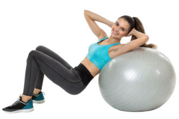 Woman exercising on a stability ball in a fitness studio