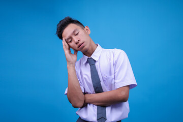 Tired Young Asian Male In Indonesian School Uniform Feeling Dizzy Suffering From Headache