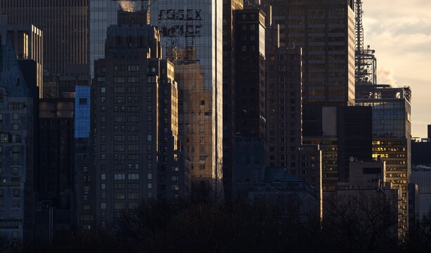 Fototapeta Dramatic sunrise light on New York City skyscrapers