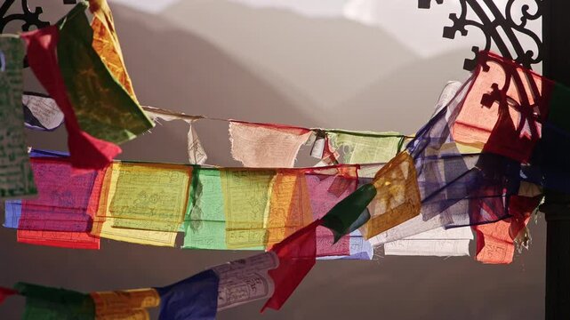 Colorful Tibetan Prayer Flags Waving in Mountain Wind
