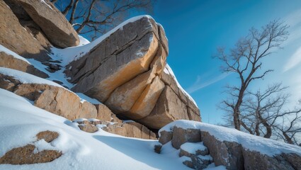 Mountain rocks showcase natural geological patterns and textures with snow-covered surfaces highlighting raw stone formations