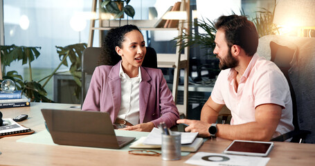 Meeting, laptop and business people in office for discussion, planning and collaboration for project. Professional, talking and man and woman with documents for online report, research and website