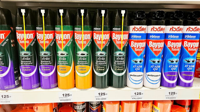Pesticide Products on Shelf: A shelf filled with various Baygon insecticide sprays in colorful packaging, showcasing different types in a retail setting. Thailand, April 24, 2025