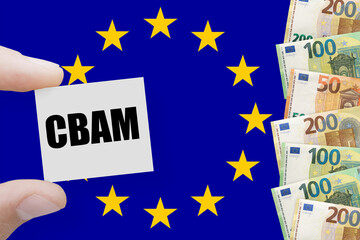 Euros notes on a European union flag background with word CBAM