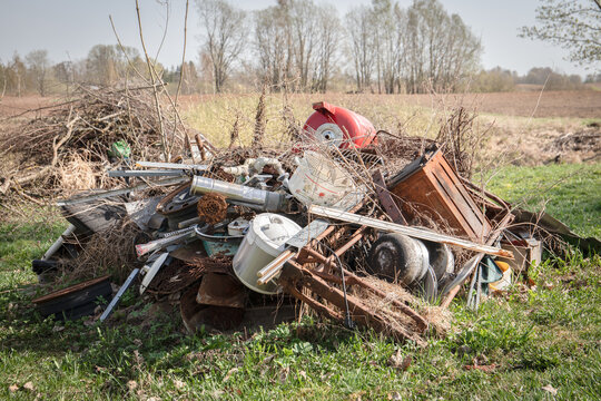 Pile of Scrap Metal and Old Items in Rural Yard