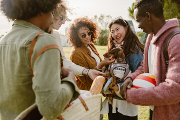A multinational group of young people, consisting of a Black man, a White man, a Black woman, and...