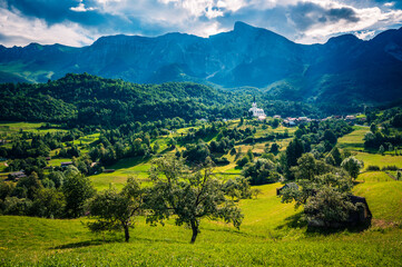 Slovenia, panorama of the Isonzo valley. Nestled at the foot of the Alps, the village of Drežnica.