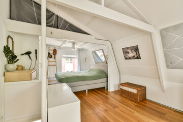 A spacious and stylish bedroom featuring minimalist decor, wood flooring, and soothing color palettes for a relaxing atmosphere.