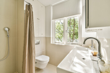 A bright and airy bathroom featuring natural light, clean lines, and modern fixtures, emphasizing a minimalist aesthetic and functional design.