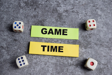 Concept of Game time write on sticky notes isolated on Wooden Table.