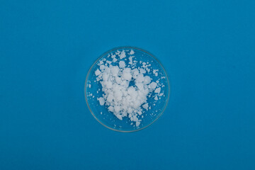 Calcium nitrate in Petri dish. Inorganic salt of nitric acid. Fertilizer popular in greenhouse and hydroponics trades. Other names: Kalksalpeter, Norgessalpeter, nitrocalcite, Norwegian salpeter