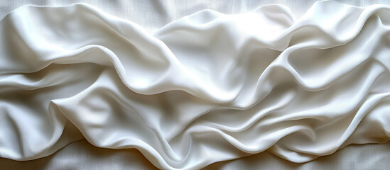 Obraz premium Soft, flowing white fabric draped in elegant folds.