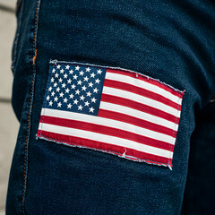 Obraz premium Patriotic American Flag Patch on Denim Jeans
