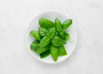 Green pears on white marble background, top view