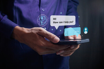Man using smartphone with virtual screen of artificial intelligence robot or chatbot technology concept