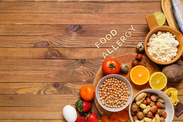 Different products with text FOOD ALLERGY on wooden background