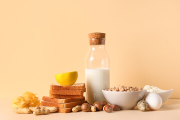 Different products on beige table. Food Allergy Awareness Month