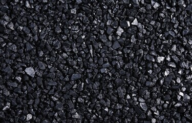 A closeup image of black cloth with a prominent swirl texture