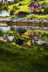 View of norwegian landscape with houses on the water