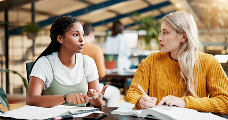 College, teamwork and women in library with books, project and discussion for assignment together. Knowledge, learning and people studying with education for exam, scholarship and university test