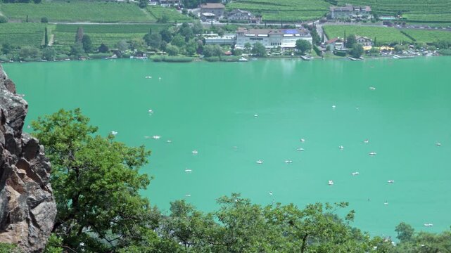 View of Lake Kaltern - Caldaro in South Tyrol, Italy from a high view point on a sunny day in summer