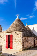 beautiful traditional white houses trulli in italian region Puglia. Trullo is a old masonry house...