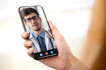 Patient making video call with doctor online via smartphone, home medical consulation service and telehealth concepts