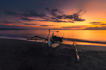 fishing boat at sunrise time at Pantai pulau Santen Banyuwangi East Java Indonesia