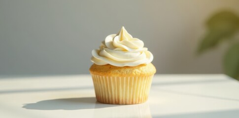 Vanilla cupcake with creamy frosting on a minimalist table, lit by soft natural light , sweetness, pastry