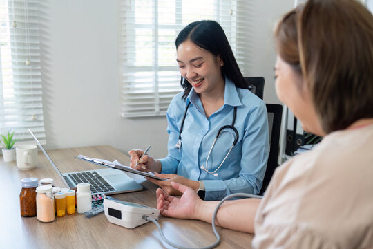 Consultation and Health Assessment. A general practitioner discussing health with a patient during a medical visit.