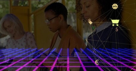 Three women standing at bus stop, using smartphones over neon grid showing ecommerce icons - Powered by Adobe