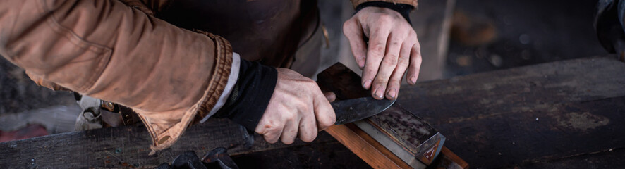 Panorama view blacksmith in leather apron at trade workshop, Mansfield, Missouri, Caucasian...