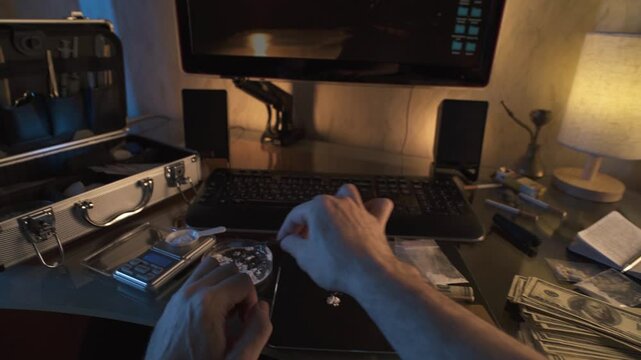 Drug addicted man rolling up dollar bill and snorting white powder. Drug trafficking and distribution. Point of view shot.