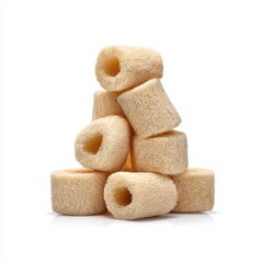 Pile of loofah rings stacked neatly on white background