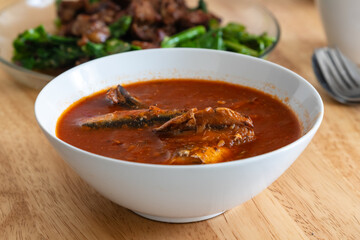 a bowl of sardines in tomato sauce