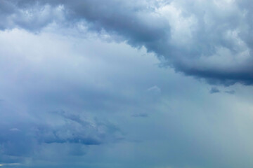 Dark storm clouds. Gray, dramatic cloudy sky. Full screen. Free space for text available as a template.