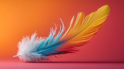 Obraz premium Colorful feather is displayed on a red background. The feather is made up of different colors, including blue, yellow, and white. Concept of vibrancy and beauty
