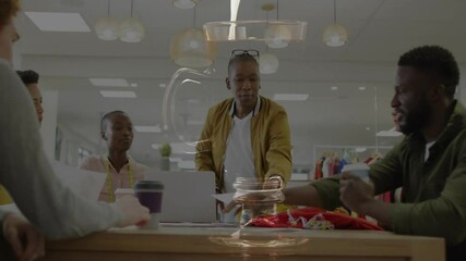 design team collaborating in fashion design office overlaying animated sketches measuring tape data - Powered by Adobe