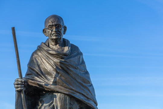 Statue of Mahatma Gandhi against a clear blue sky. Symbol of peace and Indian independence. Utrecht, the Netherlands. 8 April 2025.