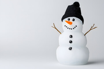 Fototapeta premium A cute little snowman made from ice against a white background